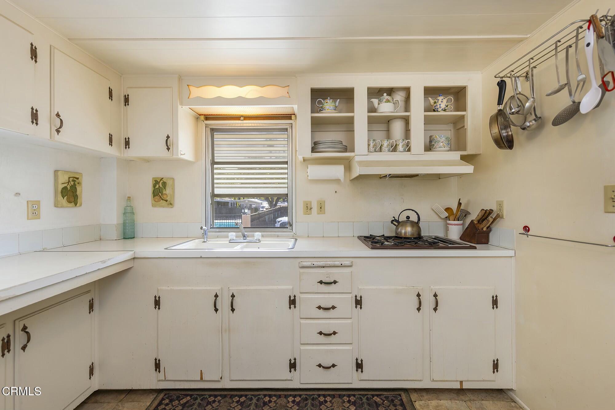 1225 South Rice Road, Unit 6 Ojai, CA 93023 - Photo 10 of 21 a kitchen with cabinets and window