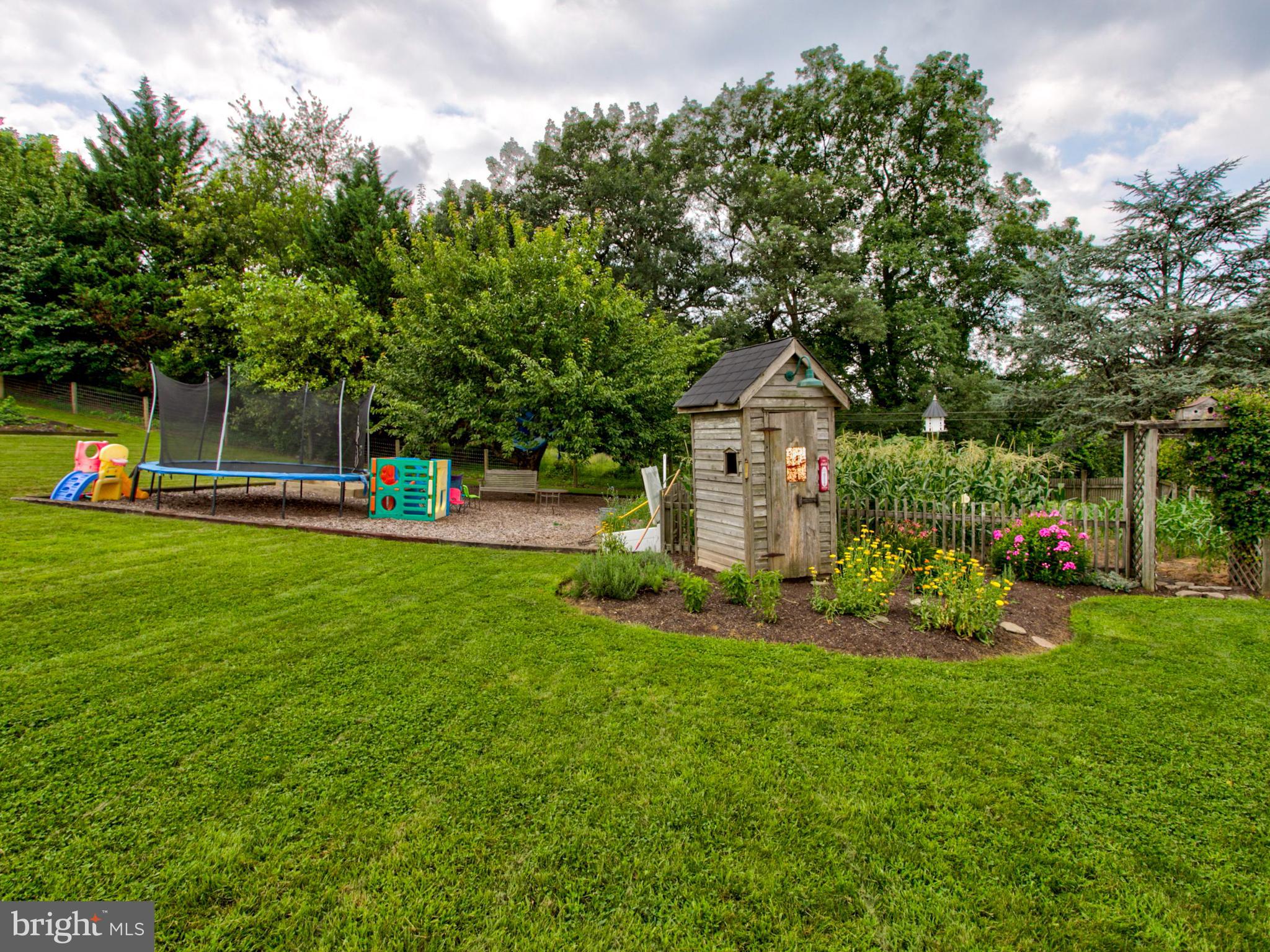 8486 Elizabethtown Road Elizabethtown, PA 17022 - Photo 23 of 58 a front view of a house with garden