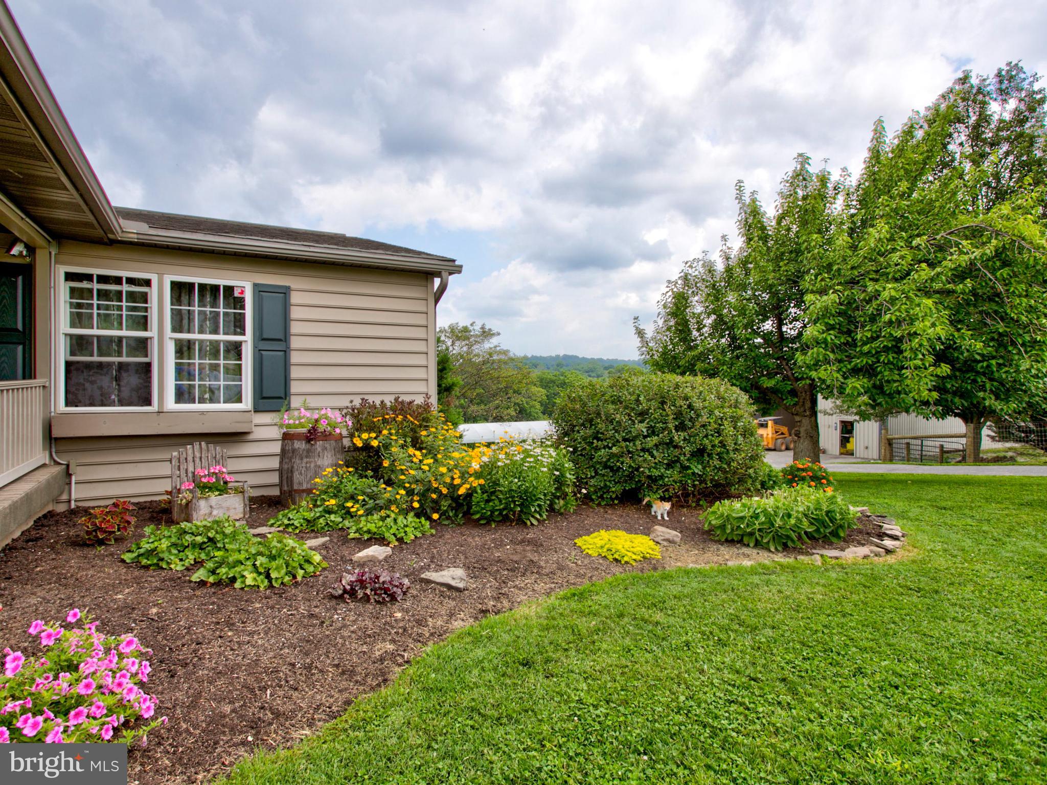 8486 Elizabethtown Road Elizabethtown, PA 17022 - Photo 27 of 58 a view of a house with backyard and garden