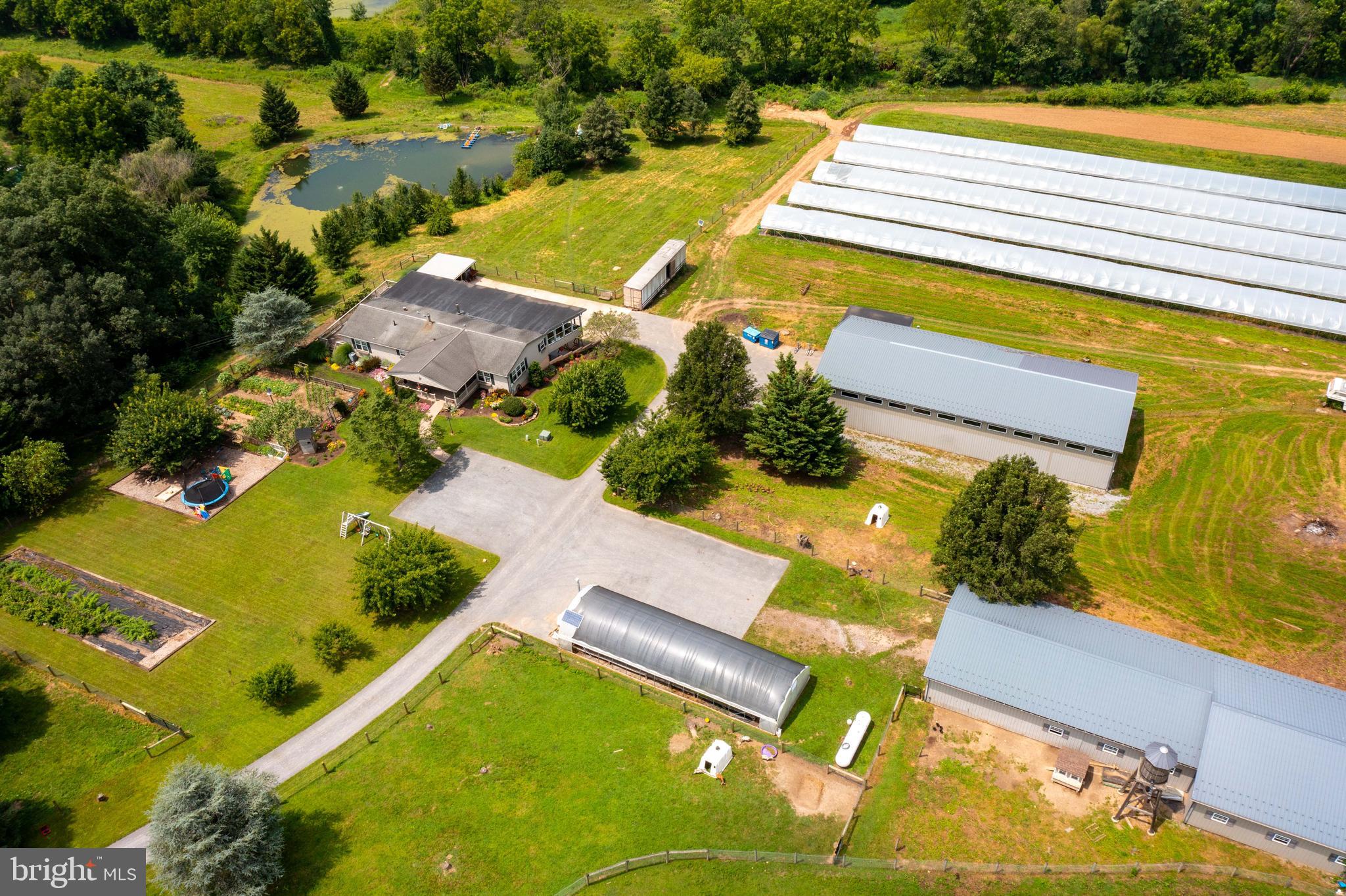 8486 Elizabethtown Road Elizabethtown, PA 17022 - Photo 3 of 58 an aerial view of a house with a swimming pool