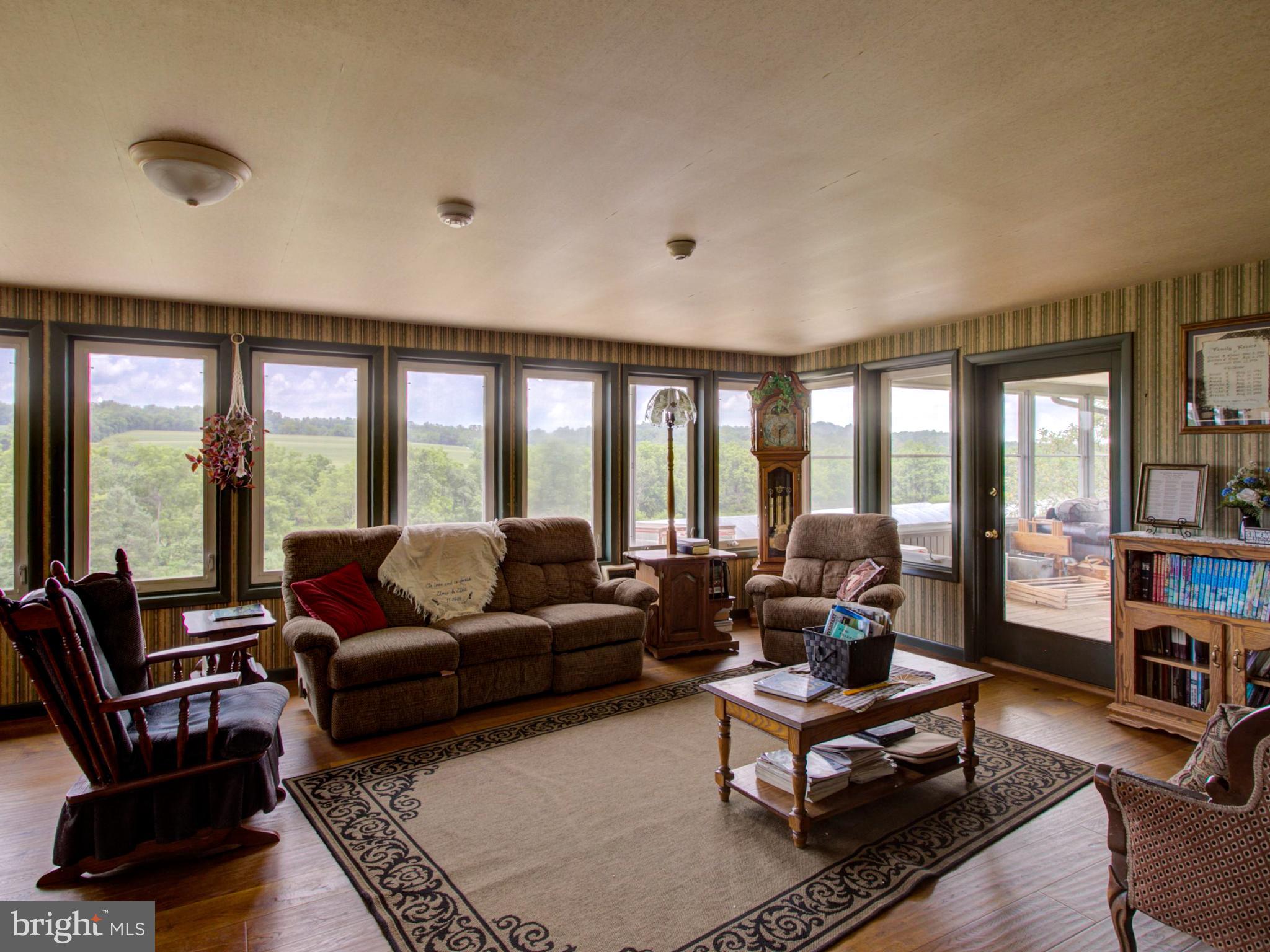 8486 Elizabethtown Road Elizabethtown, PA 17022 - Photo 38 of 58 a living room with furniture and large windows