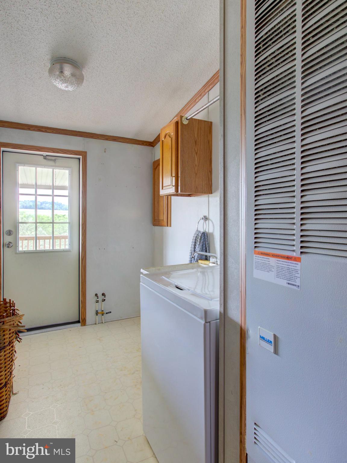8486 Elizabethtown Road Elizabethtown, PA 17022 - Photo 45 of 58 a utility room with window dryer and washer