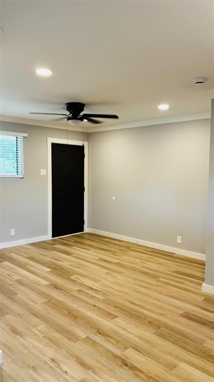 4603 Junius Street, Unit 6 Dallas, TX 75246 - Photo 3 of 12 Living room featuring light wood-style flooring, recessed lighting, ceiling fan, and ornamental molding