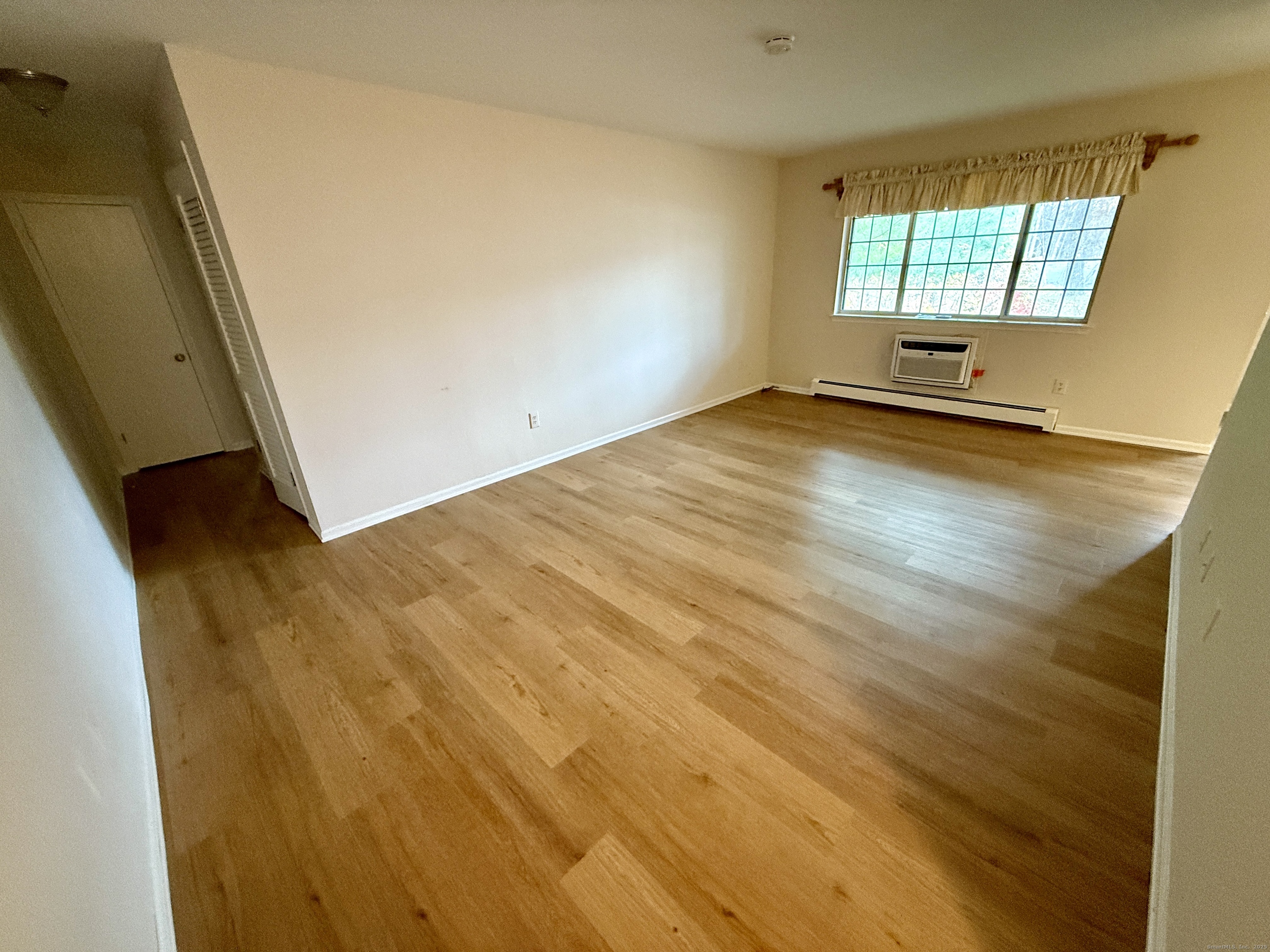 17 Rollingwood Drive, Unit 17 Brookfield, CT 06804 - Photo 5 of 13 a view of a room with wooden floor and a window