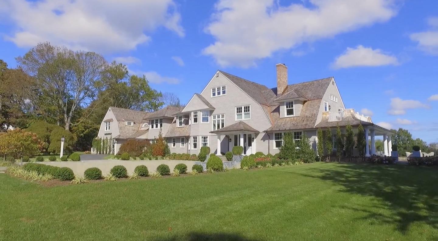 507 Smith Ridge Road New Canaan, CT 06840 - Photo 1 of 16 a front view of a house with a garden and trees