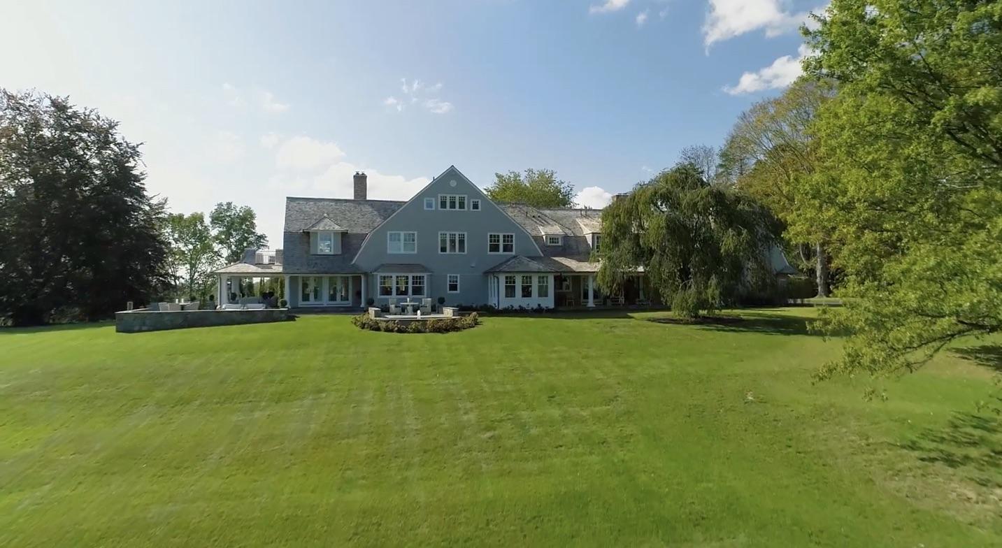 507 Smith Ridge Road New Canaan, CT 06840 - Photo 16 of 16 a front view of a house with garden