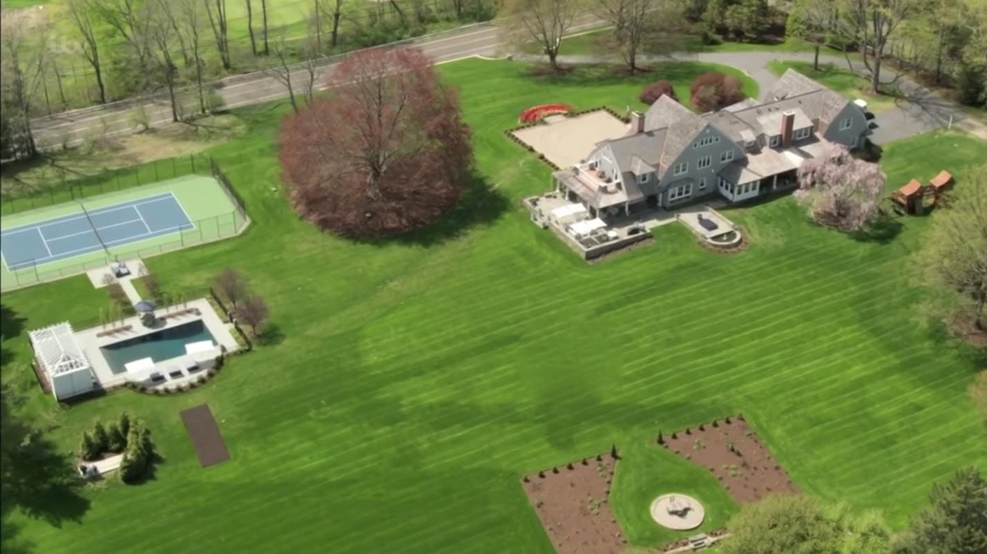507 Smith Ridge Road New Canaan, CT 06840 - Photo 4 of 16 an aerial view of a house with a garden and lots of trees