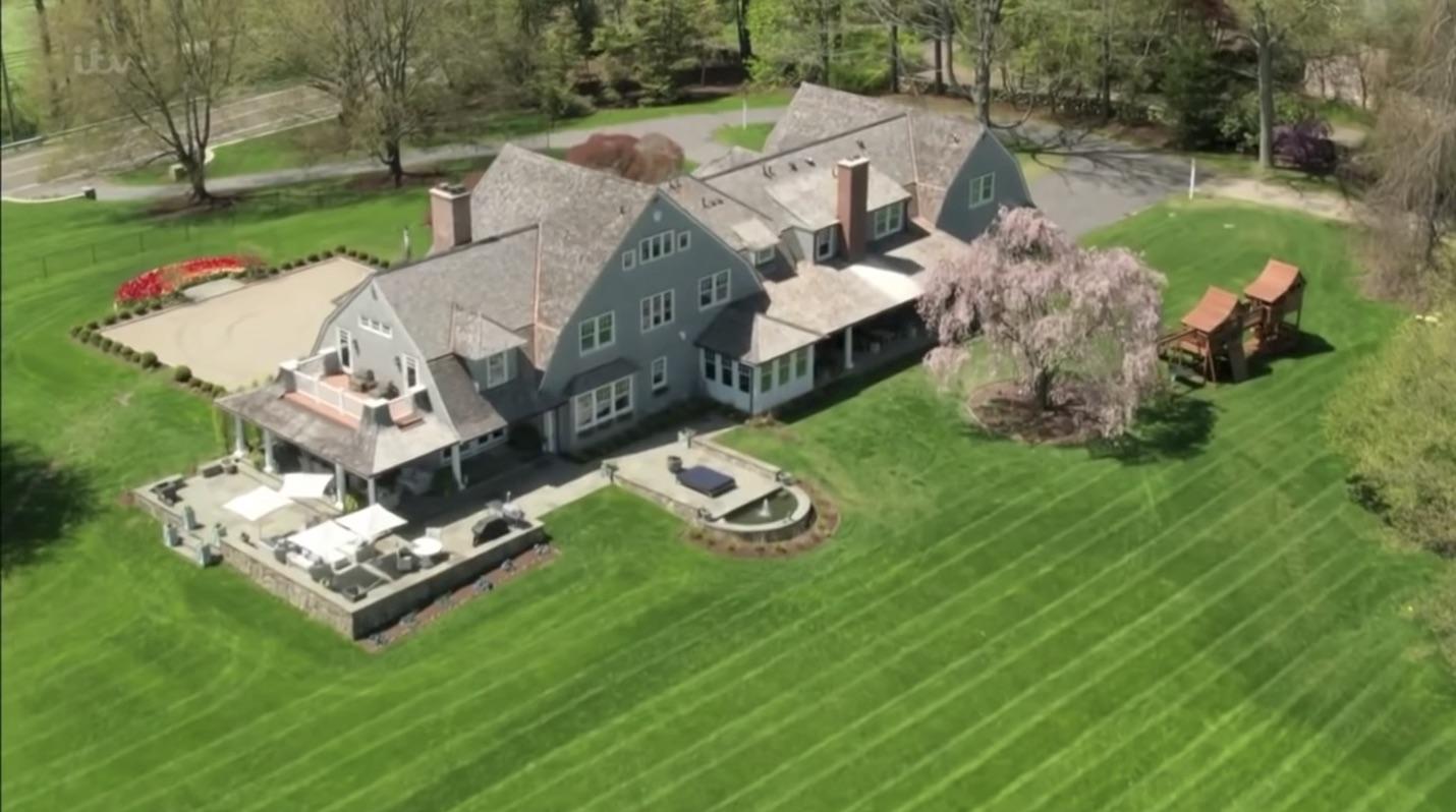 507 Smith Ridge Road New Canaan, CT 06840 - Photo 5 of 16 an aerial view of a house with a garden and lake view