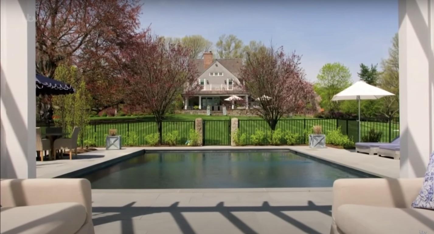 507 Smith Ridge Road New Canaan, CT 06840 - Photo 7 of 16 a view of swimming pool with seating area and trees in the background
