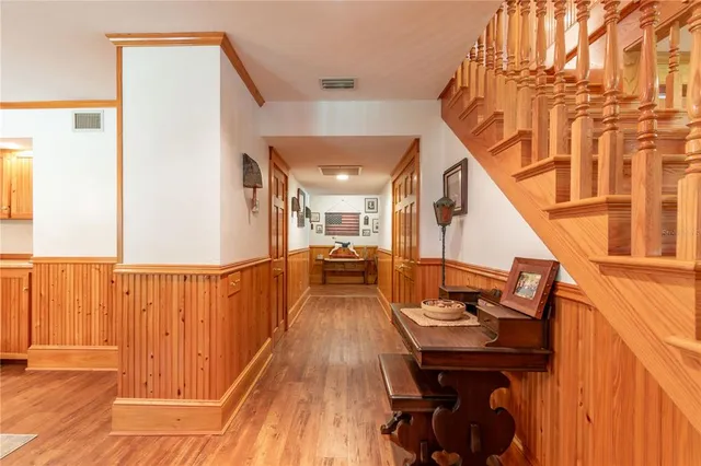 a bedroom with furniture and wooden floor
