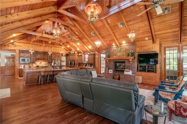 a room with wooden floors and pool table