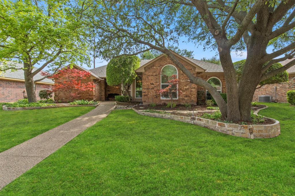 1104 Timberbend Trail Allen, TX 75002 - Photo 2 of 32 a front view of a house with a yard