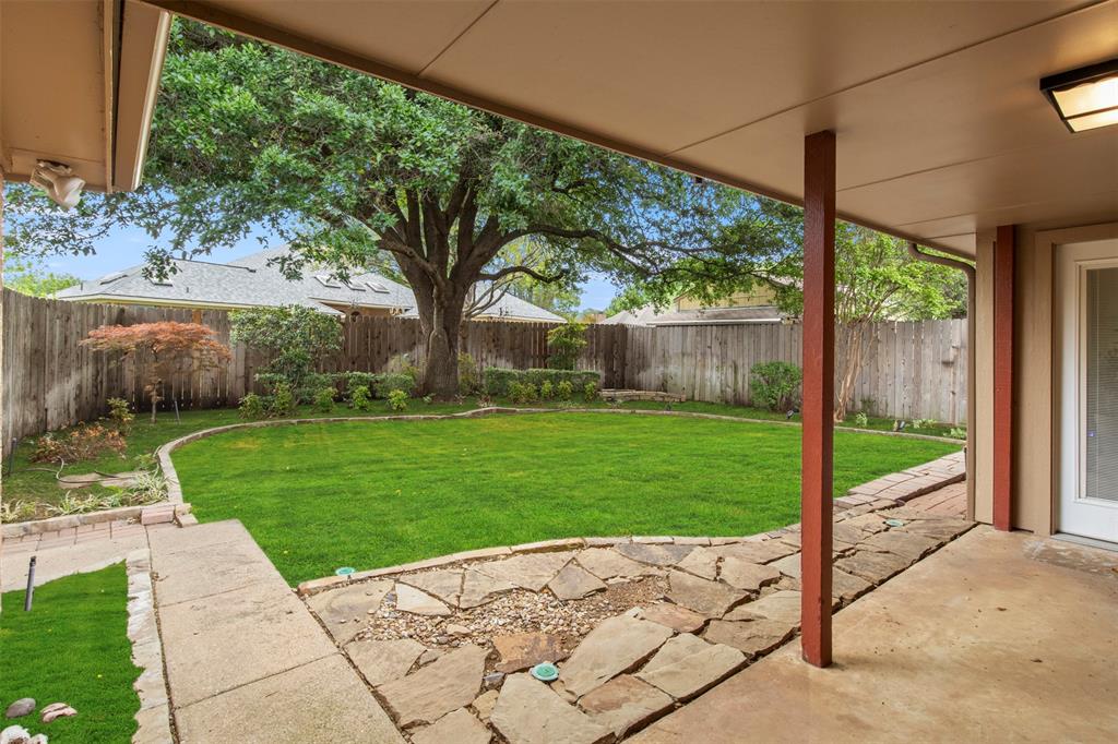 1104 Timberbend Trail Allen, TX 75002 - Photo 26 of 32 a view of a garden with a tree