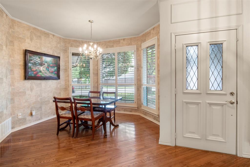 1104 Timberbend Trail Allen, TX 75002 - Photo 5 of 32 a view of a dining room with furniture window and wooden floor