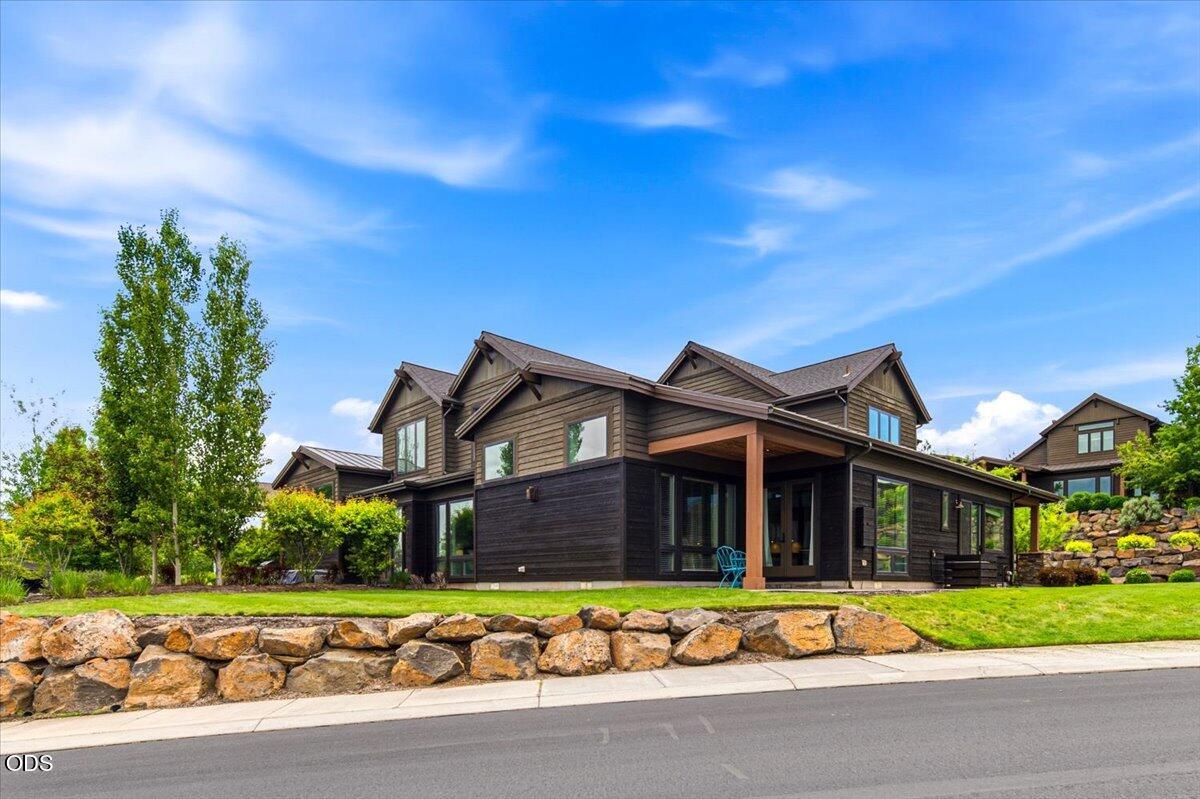 61333 Kindle Rock Loop Bend, OR 97702 - Photo 53 of 53 a front view of a house with a yard and outdoor seating