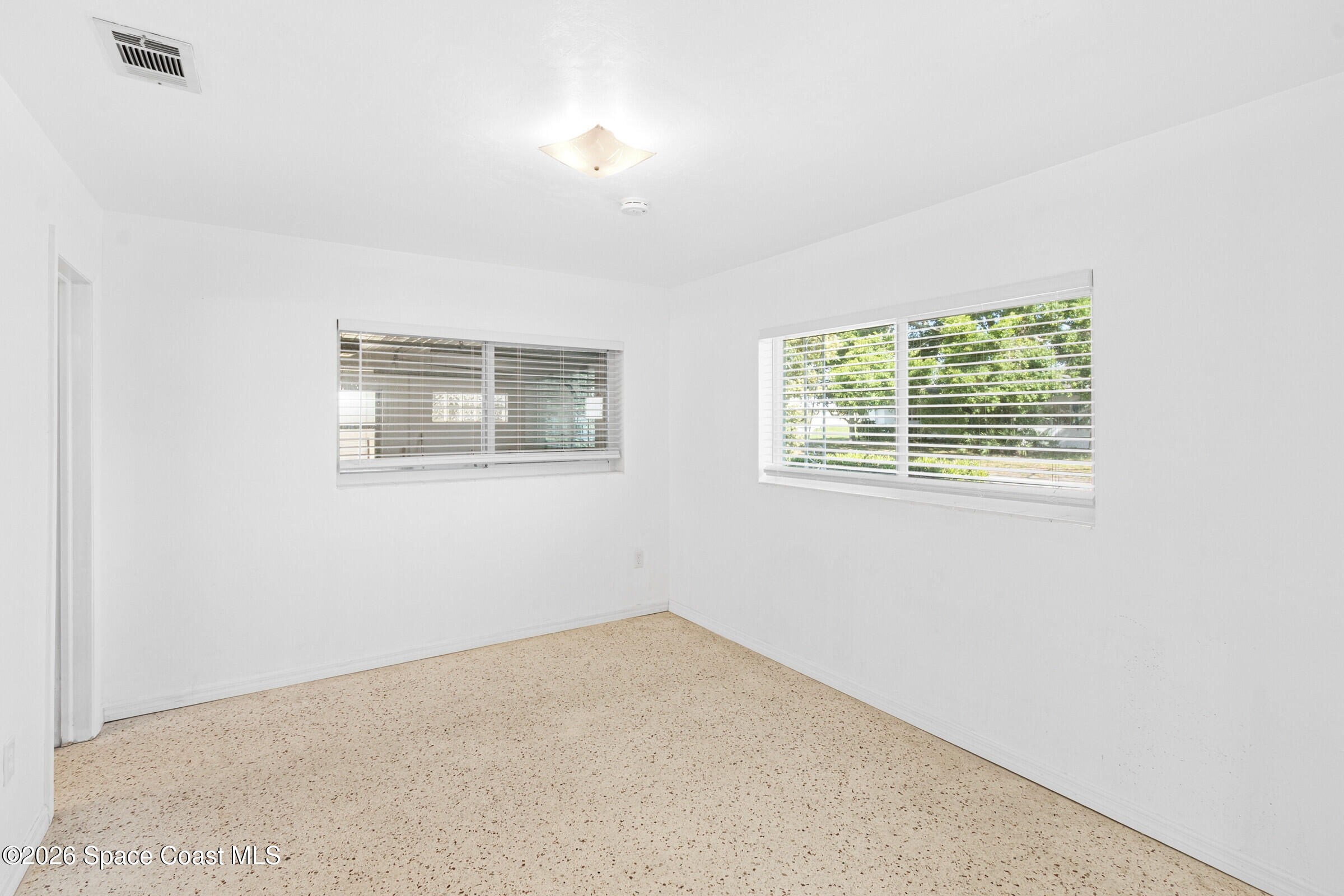407 Bunker Street Melbourne, FL 32901 - Photo 11 of 20 an empty room with windows