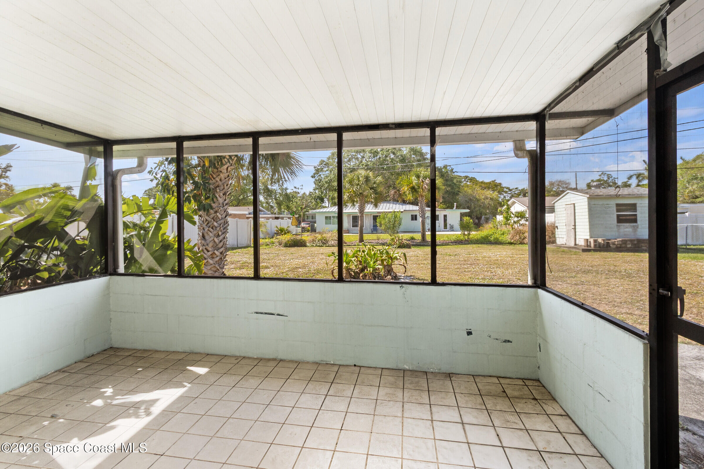 407 Bunker Street Melbourne, FL 32901 - Photo 18 of 20 a view of an empty room with a window
