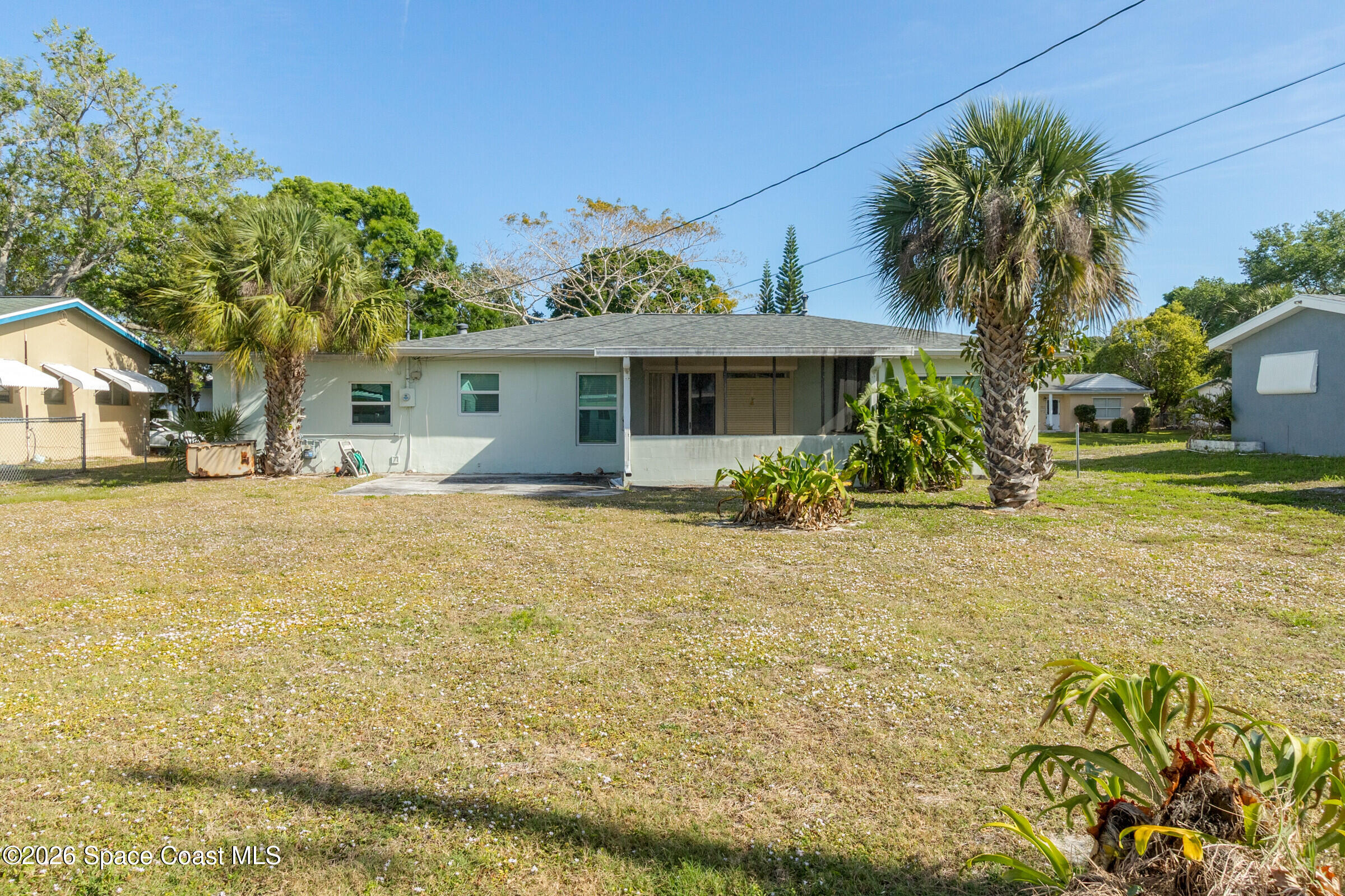 407 Bunker Street Melbourne, FL 32901 - Photo 2 of 20 a front view of house with yard and trees around