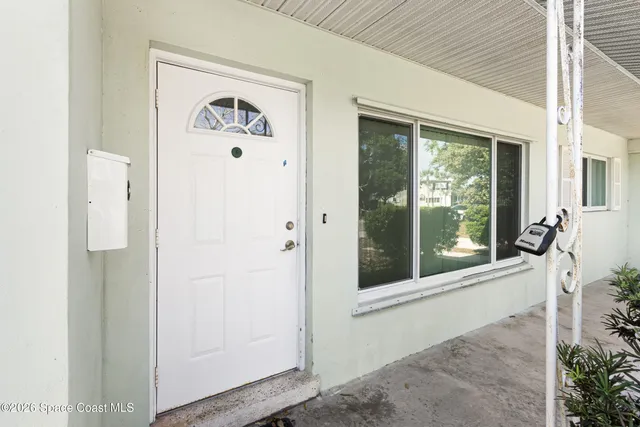 a view of a door and a window