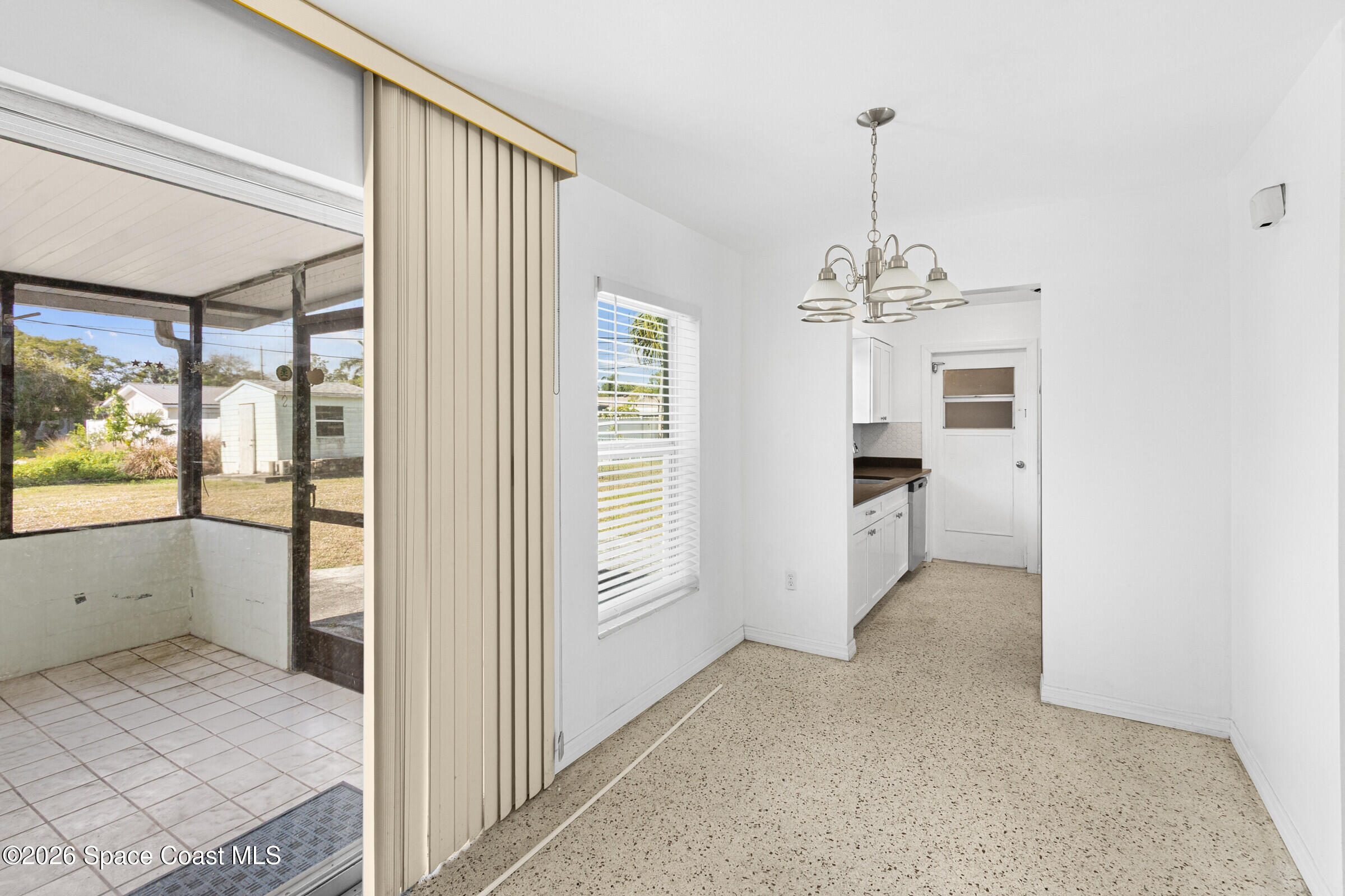 407 Bunker Street Melbourne, FL 32901 - Photo 7 of 20 a view of a livingroom with a chandelier