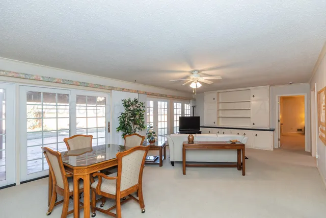 a bathroom with a sink a mirror and a shower