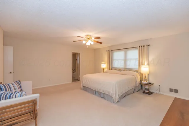 a view of backyard and tree