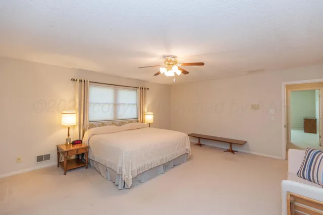 a view of big yard next to a house