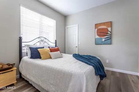 a bedroom with a bed and a couch