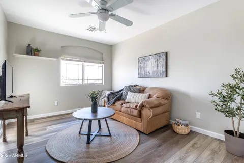 a bathroom with a granite countertop toilet sink and a mirror