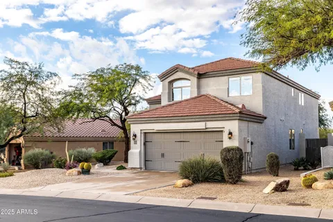 an aerial view of residential house with outdoor space and trees