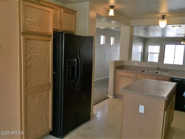a bathroom with a granite countertop sink a shower and a mirror