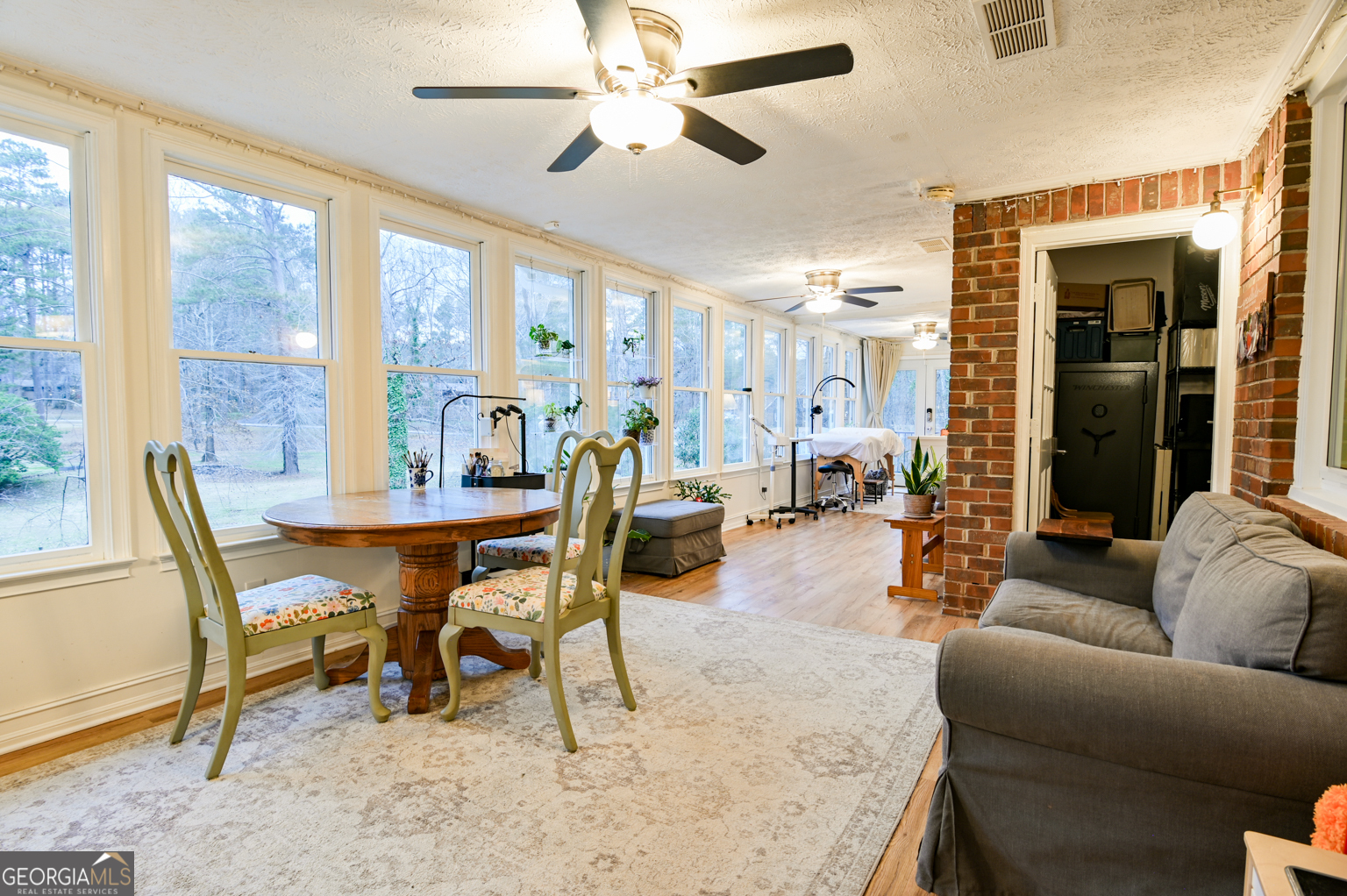 93 Deerfield Road Covington, GA 30014 - Photo 22 of 78 a living room with furniture and a dining table