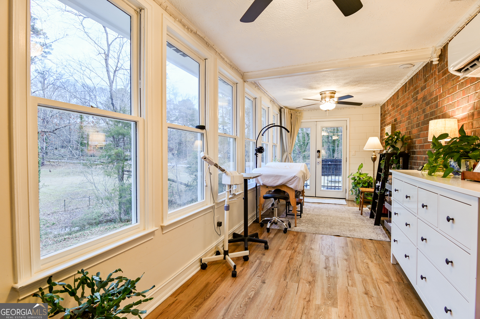 93 Deerfield Road Covington, GA 30014 - Photo 24 of 78 a very nice looking room with wooden floor and a large window