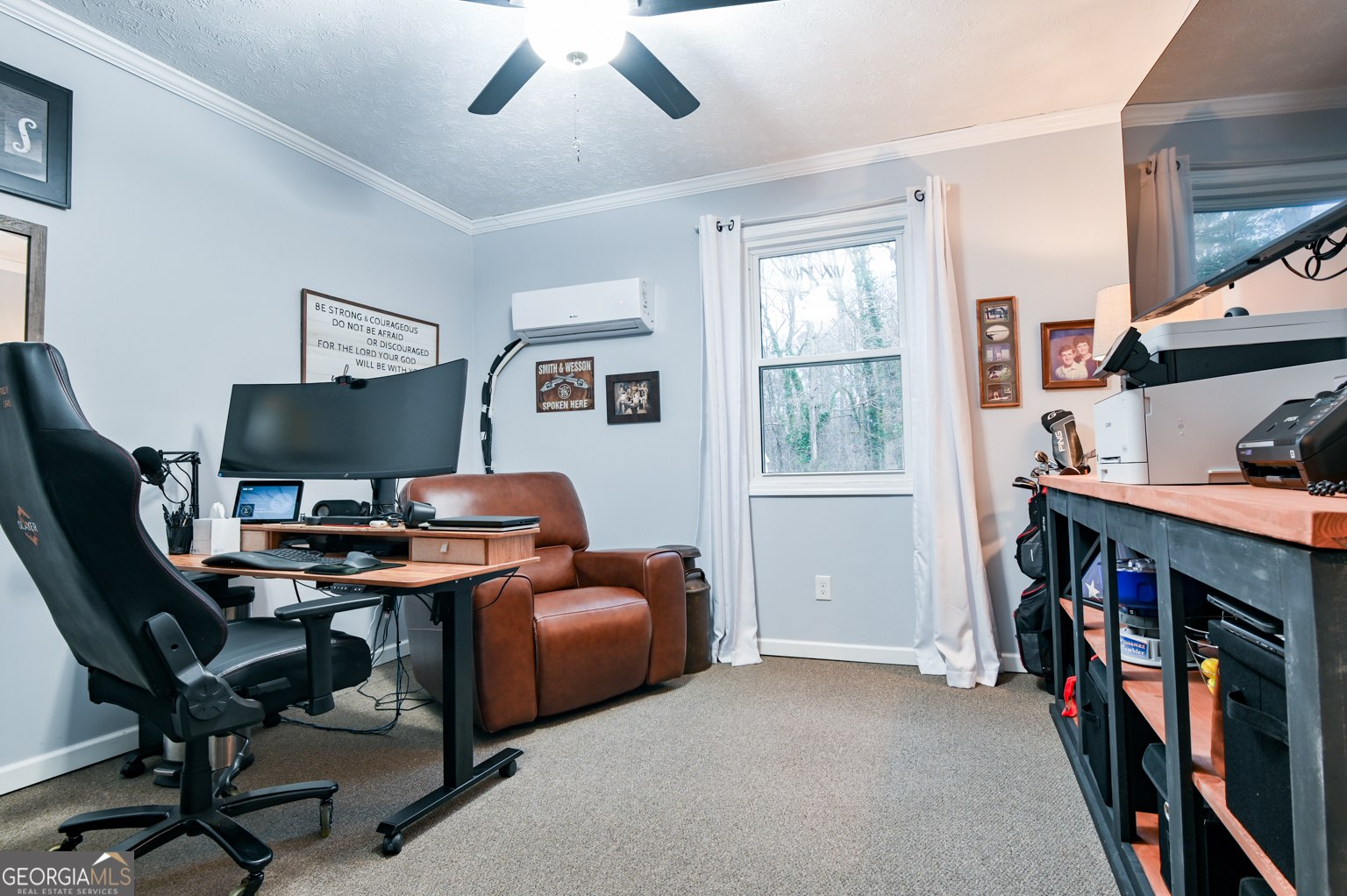93 Deerfield Road Covington, GA 30014 - Photo 27 of 78 a view of a workspace with furniture and a window