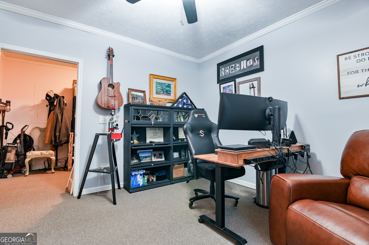 93 Deerfield Road Covington, GA 30014 - Photo 28 of 78 a room with furniture and a flat screen tv
