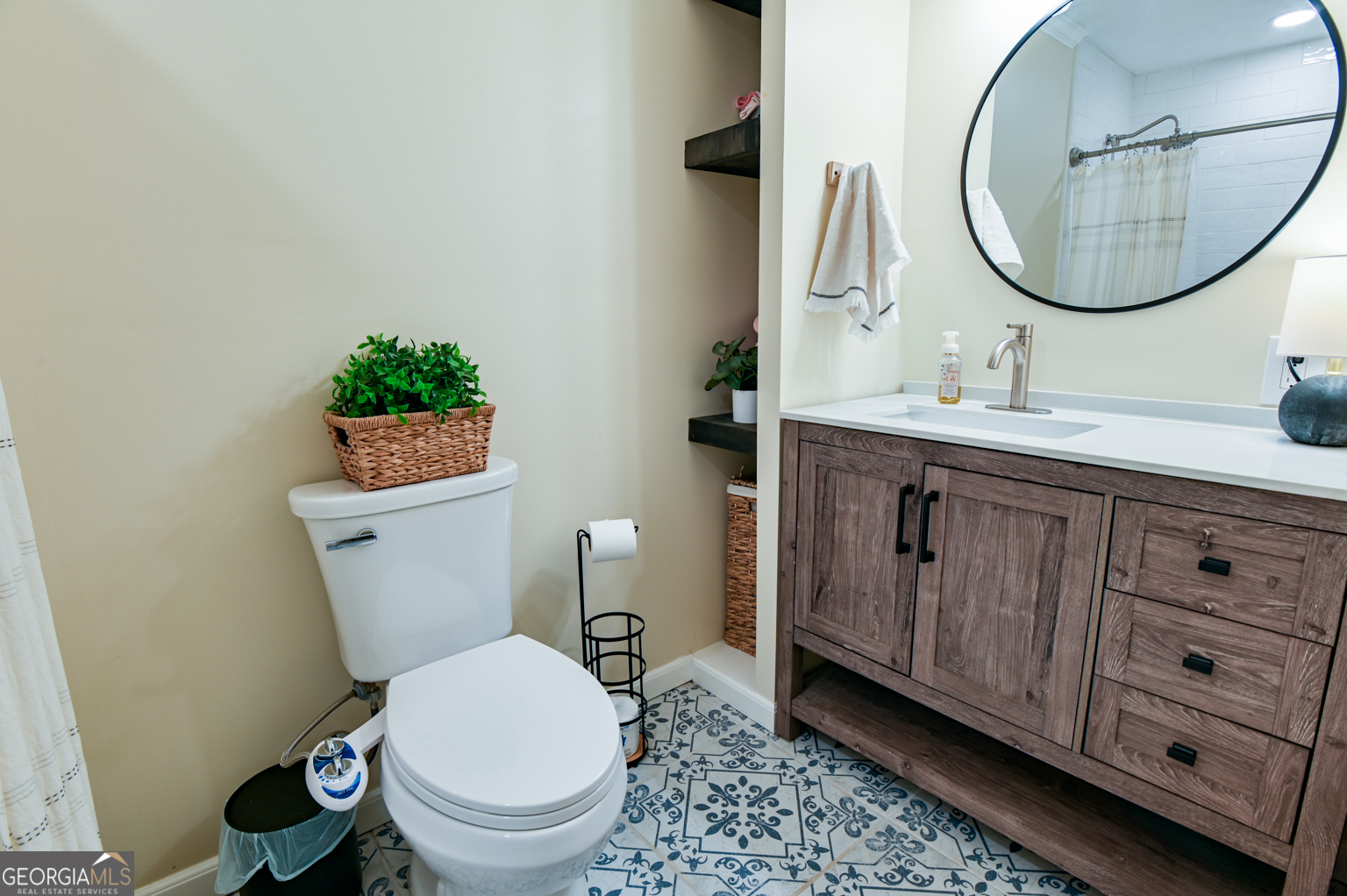 93 Deerfield Road Covington, GA 30014 - Photo 33 of 78 a bathroom with a toilet a sink and a mirror