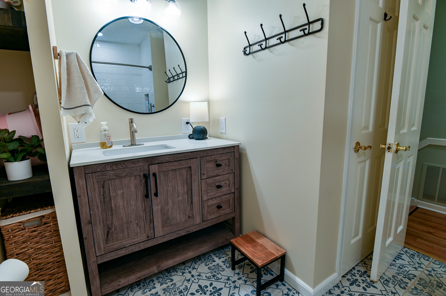 93 Deerfield Road Covington, GA 30014 - Photo 36 of 78 a bathroom with a sink and a mirror
