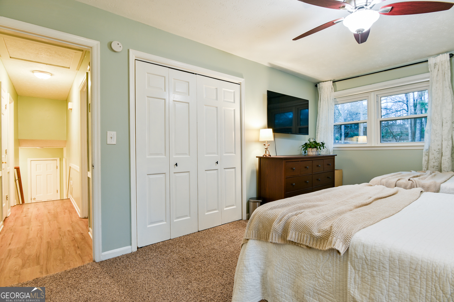 93 Deerfield Road Covington, GA 30014 - Photo 38 of 78 a bedroom with a bed and a flat screen tv