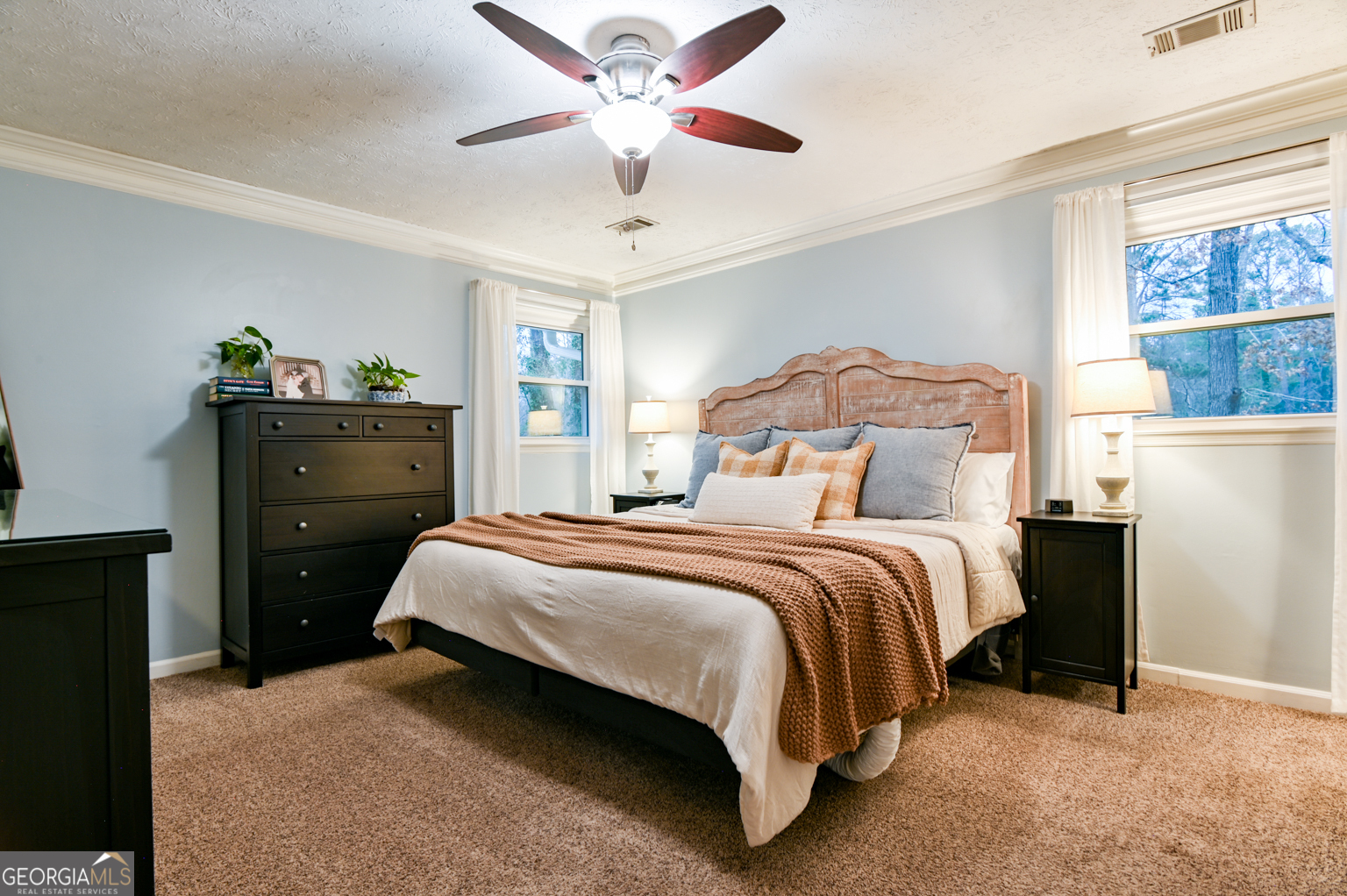 93 Deerfield Road Covington, GA 30014 - Photo 39 of 78 a bedroom with a bed and wooden floor