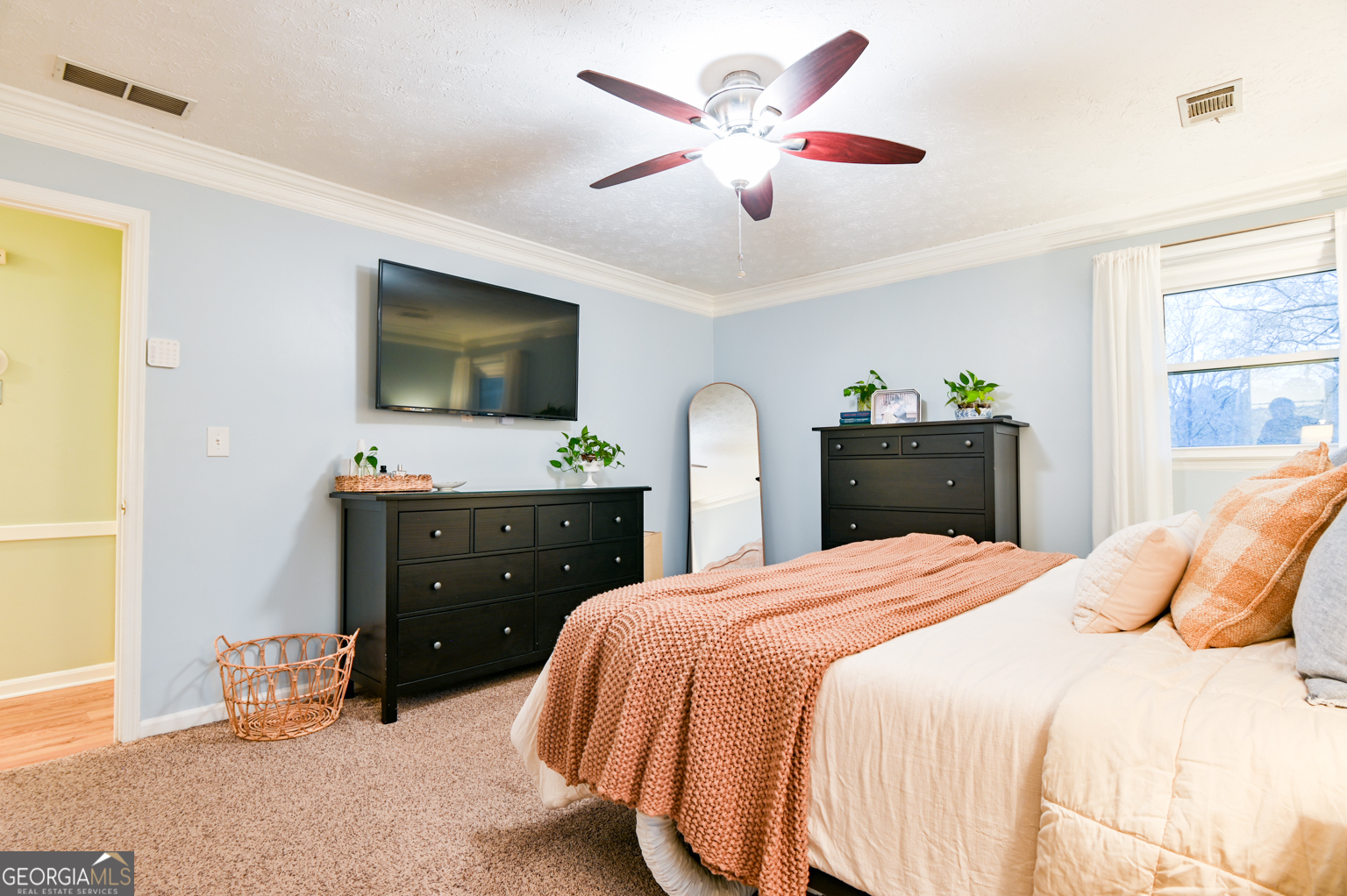 93 Deerfield Road Covington, GA 30014 - Photo 41 of 78 a bedroom with a bed and a flat screen tv