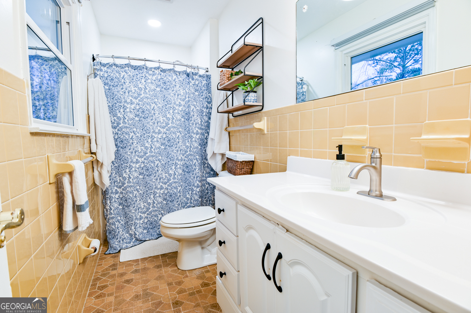 93 Deerfield Road Covington, GA 30014 - Photo 42 of 78 a bathroom with a sink and a toilet