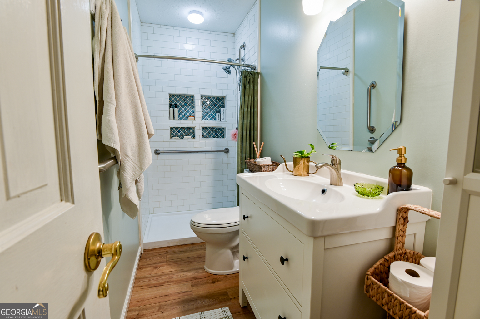 93 Deerfield Road Covington, GA 30014 - Photo 49 of 78 a bathroom with a sink toilet and shower