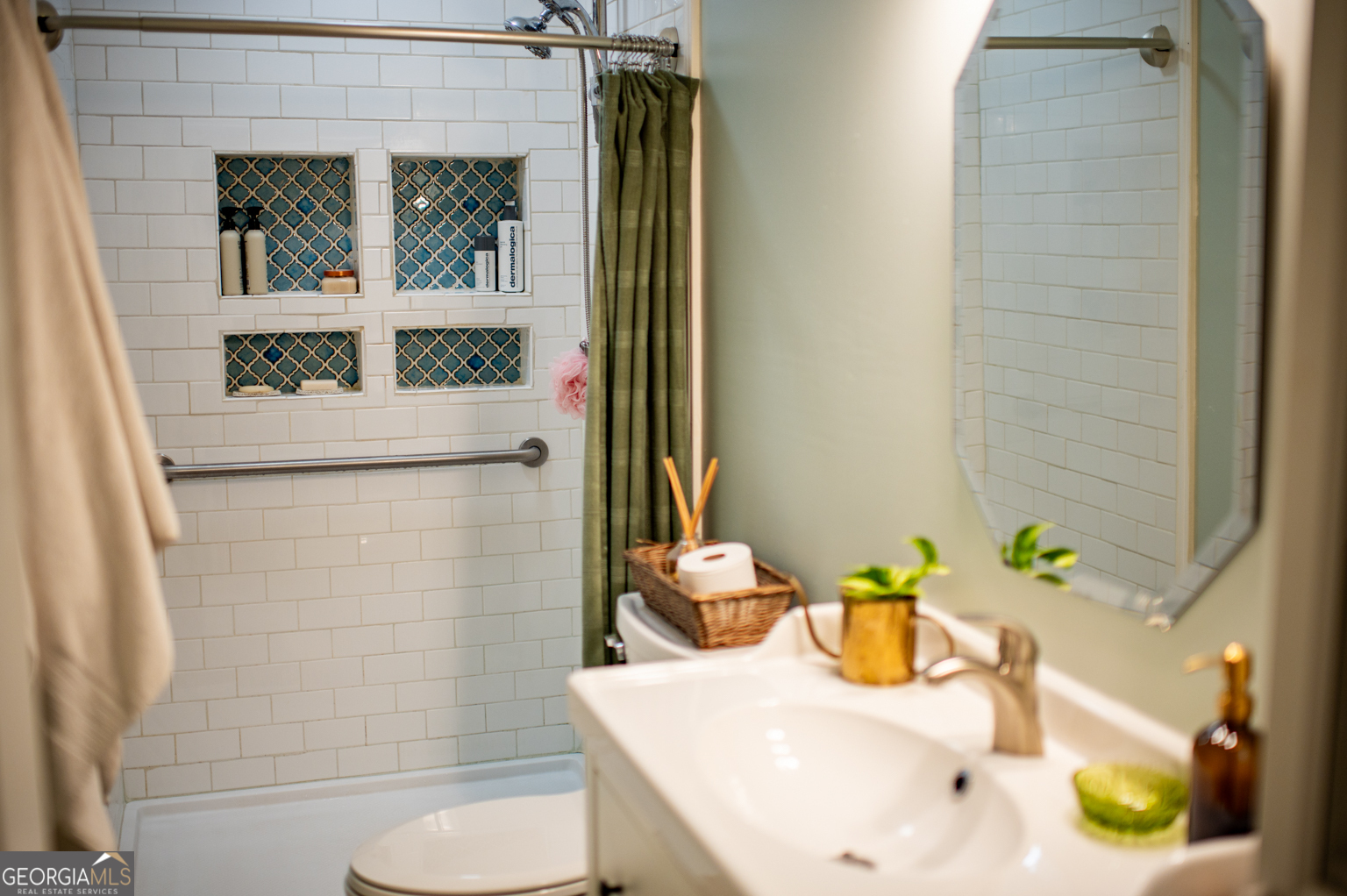 93 Deerfield Road Covington, GA 30014 - Photo 50 of 78 a bathroom with a sink and a mirror