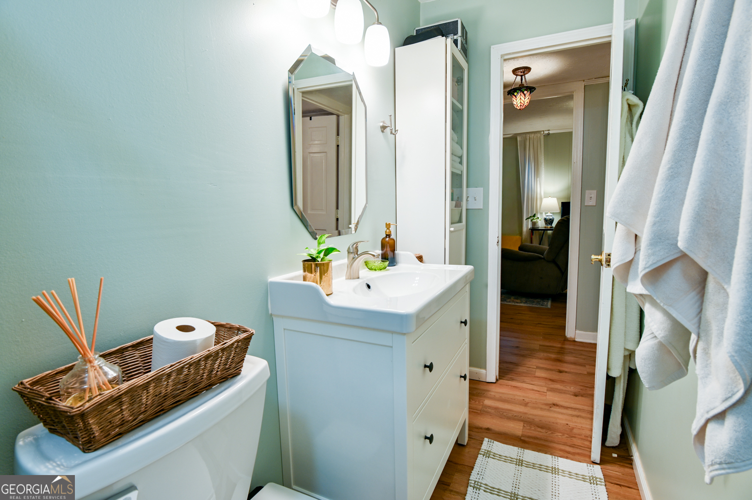 93 Deerfield Road Covington, GA 30014 - Photo 51 of 78 a bathroom with a sink toilet and mirror