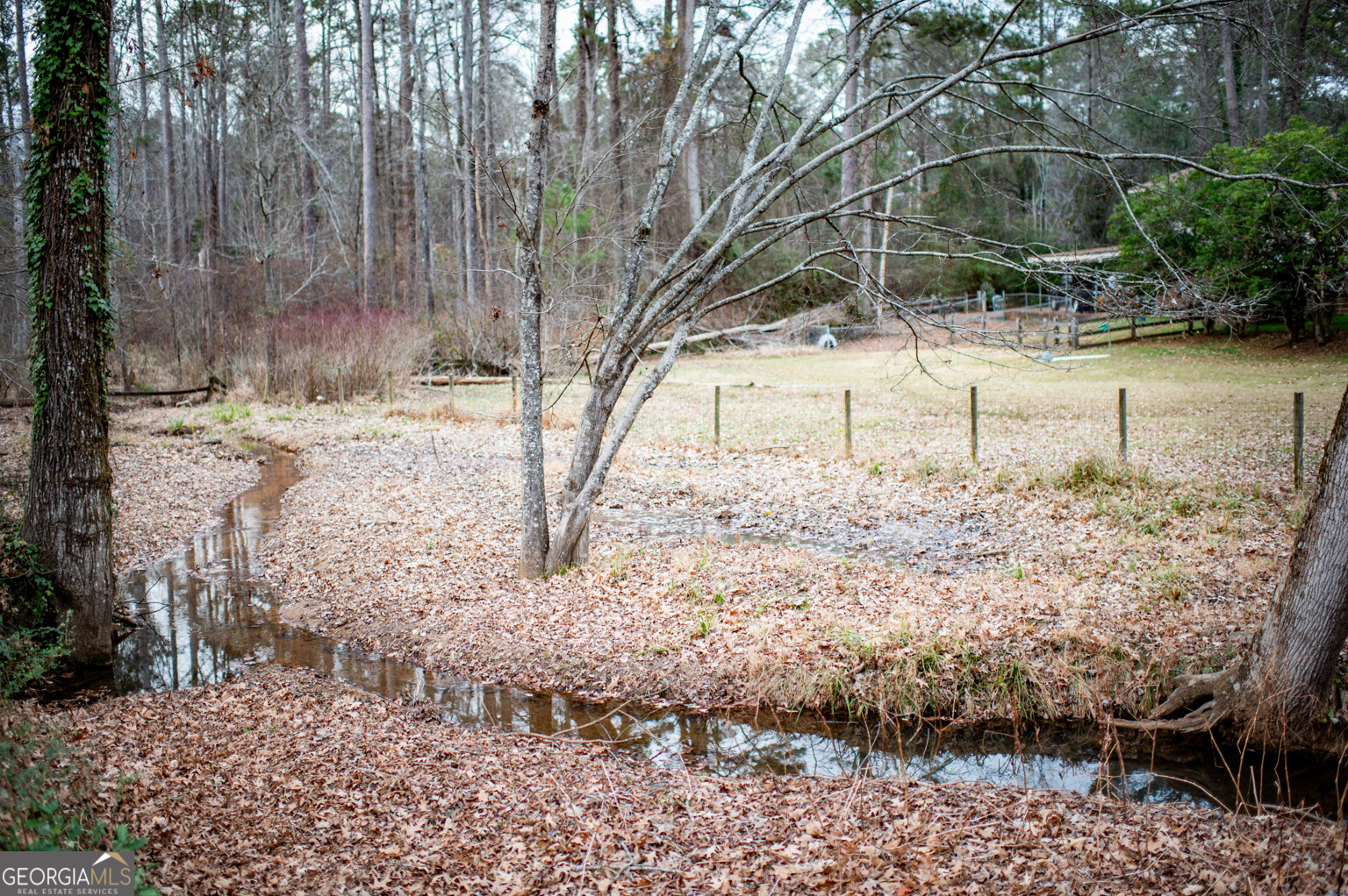 93 Deerfield Road Covington, GA 30014 - Photo 58 of 78 a view of a yard covered with snow