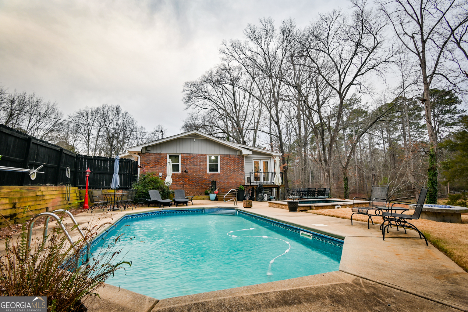93 Deerfield Road Covington, GA 30014 - Photo 65 of 78 a swimming pool view with a seating space