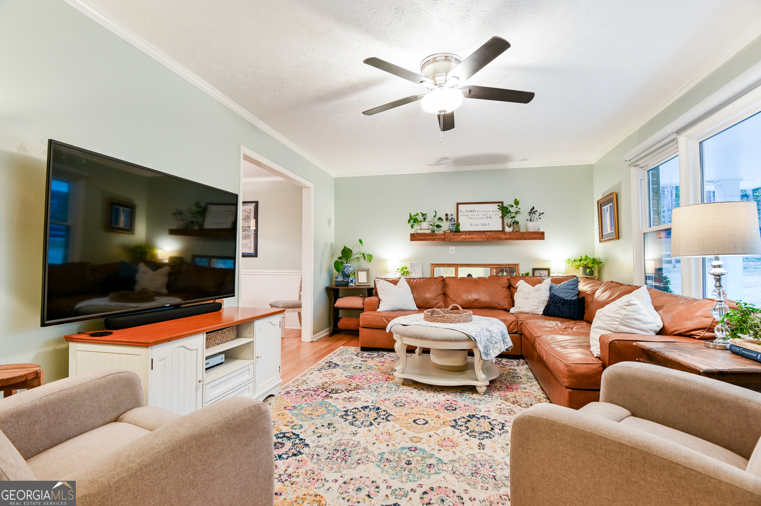 93 Deerfield Road Covington, GA 30014 - Photo 9 of 78 a living room with furniture and a flat screen tv