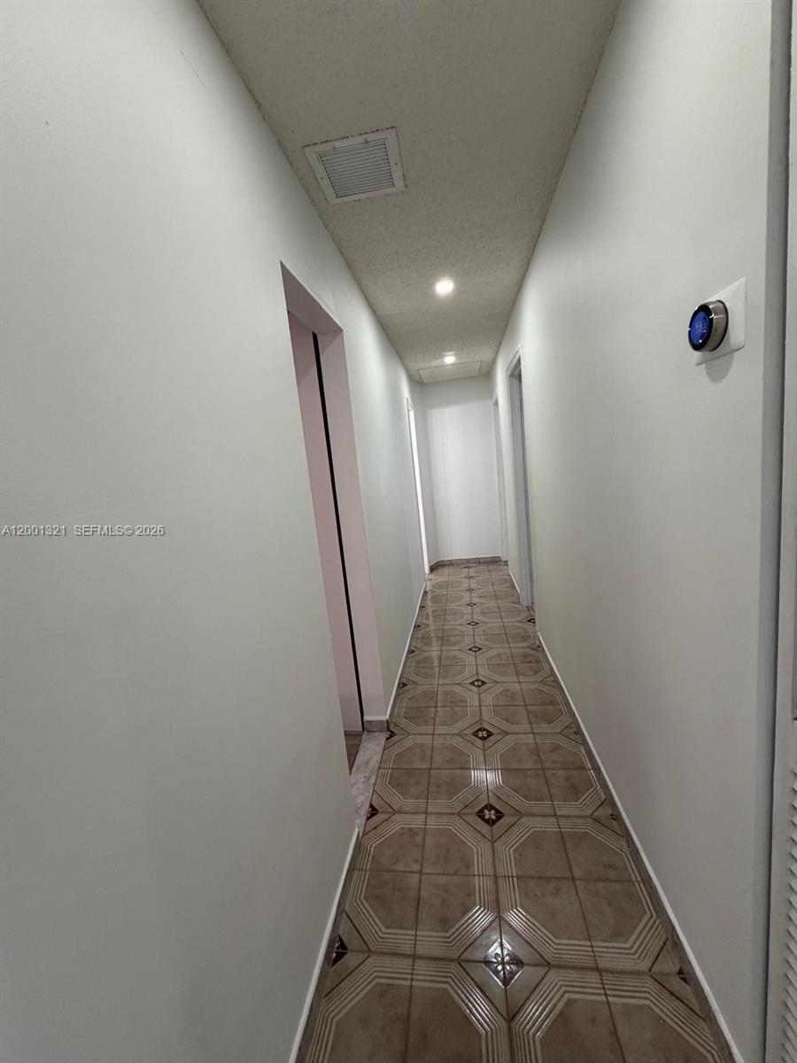 11511 Southwest 180th Street Miami, FL 33157 - Photo 13 of 22 a view of a hallway