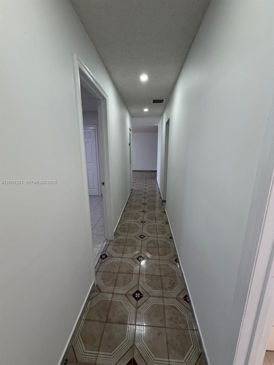 11511 Southwest 180th Street Miami, FL 33157 - Photo 16 of 22 a view of hallway with stairs