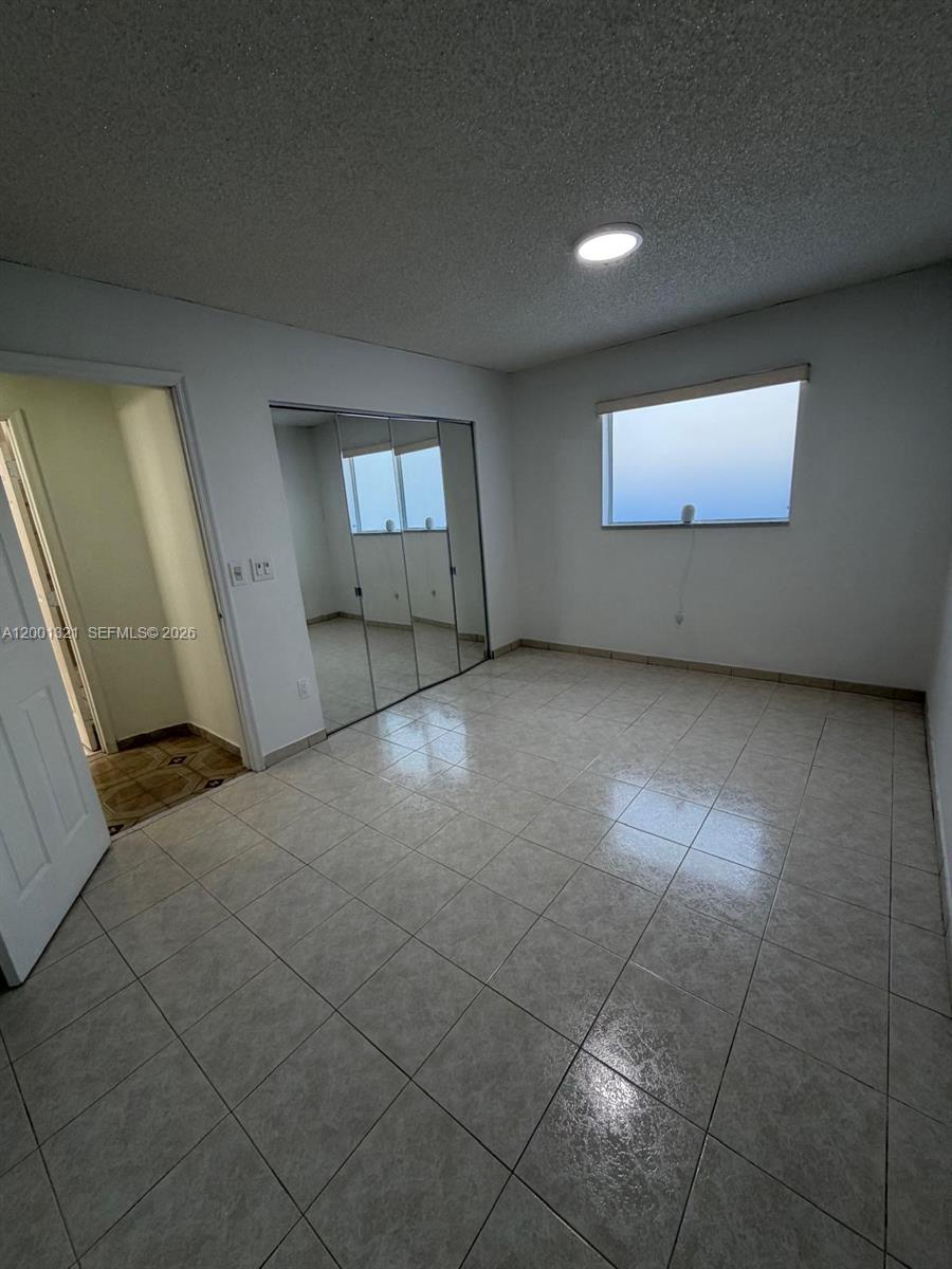 11511 Southwest 180th Street Miami, FL 33157 - Photo 18 of 22 a view of a livingroom with a staircase